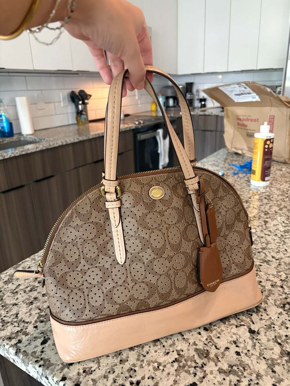 Coach Peyton perforated hand bag.